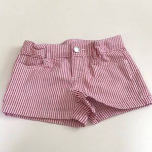 Red and white vertical stripe shorts.